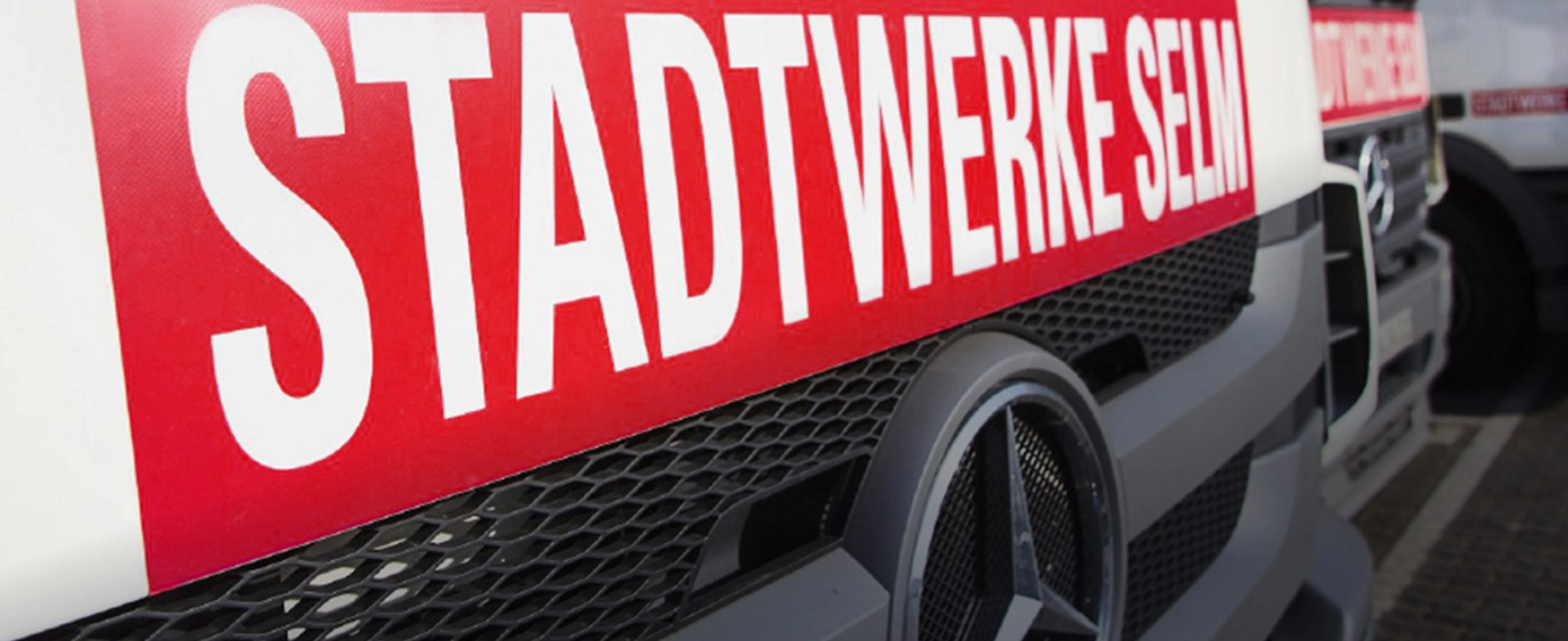 Müllsammelfahrzeug mit Stadtwerke Selm Logo